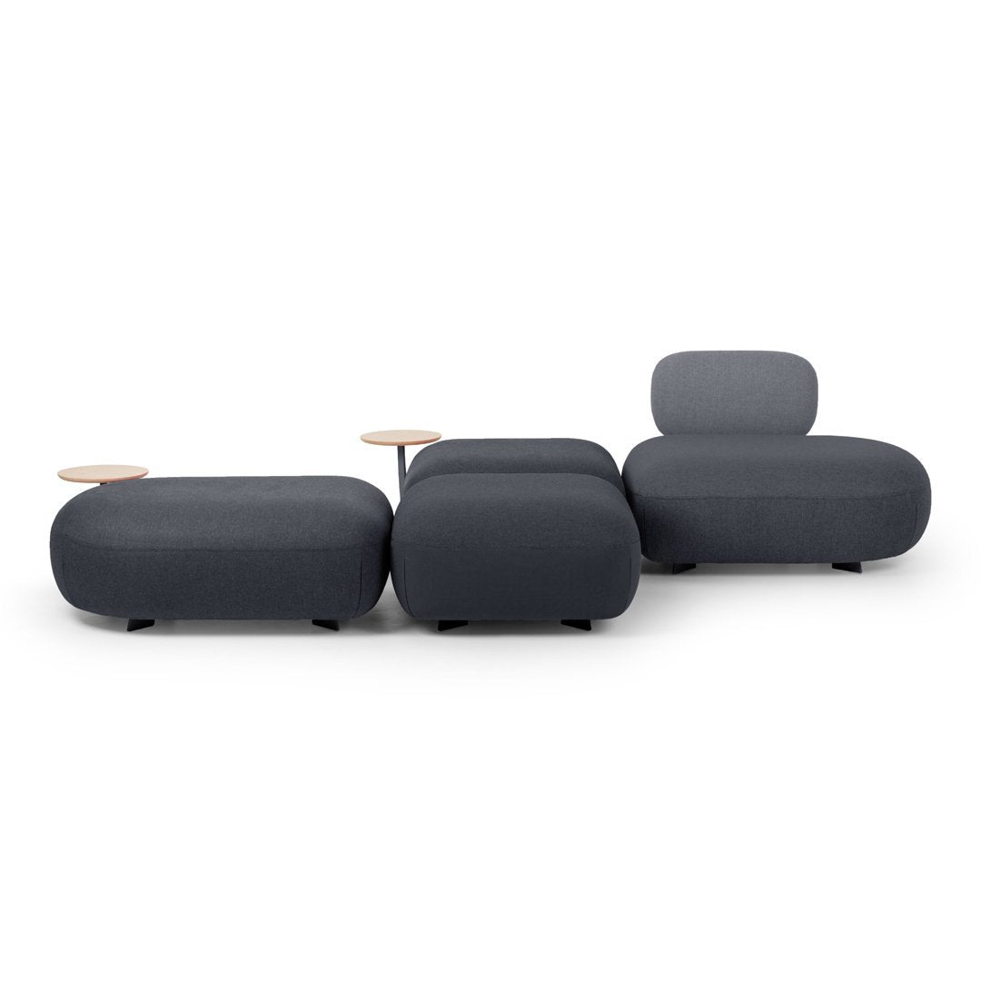 Modern gray upholstered modular sofa set with smooth curves and minimalist design, featuring light wood accent tables.