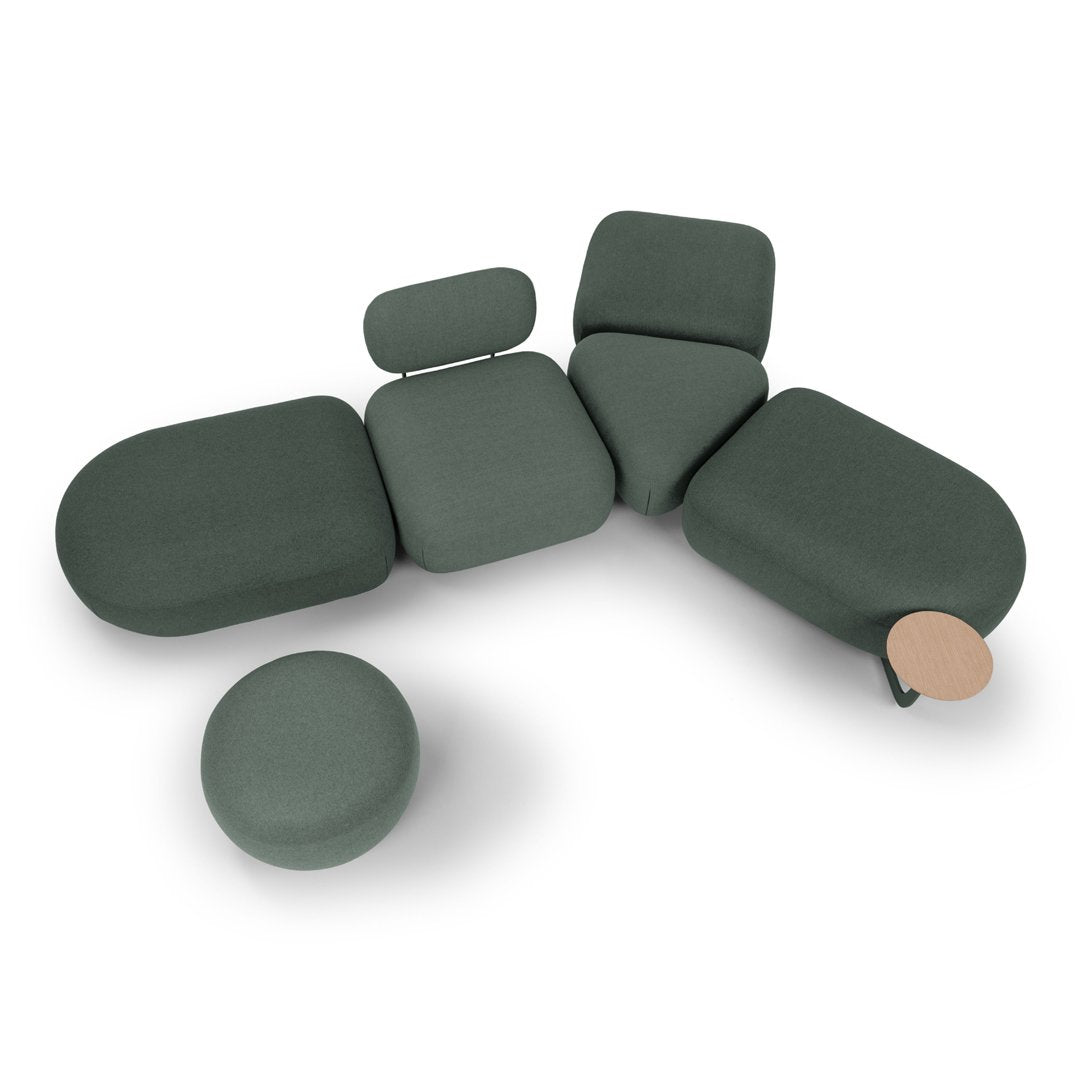 "Modern modular seating in a muted green fabric with soft, rounded shapes and a light wood accent."