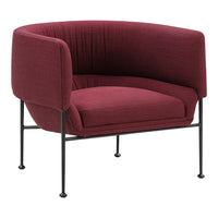 Burgundy upholstered armchair with a smooth, textured pattern and sleek black metal legs.