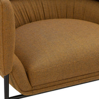 "Close-up of textured brown upholstery with subtle pattern on a modern upholstered chair."