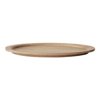 Natural wood round serving plate with a smooth, light brown finish and subtle grain patterns. Ideal for dining.