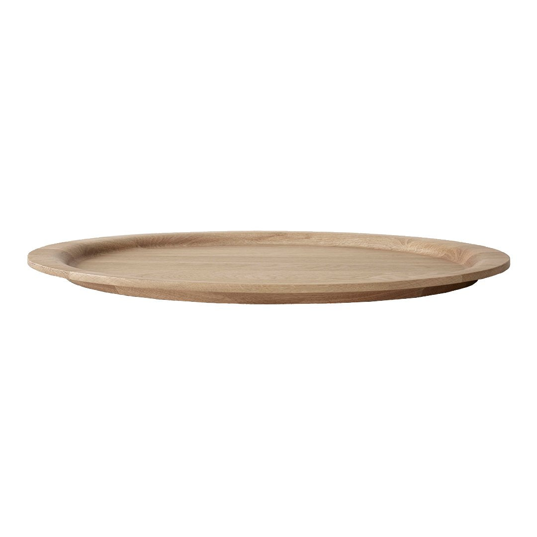 Light wood round serving platter with a smooth, natural finish. Minimalist design enhances any table setting.