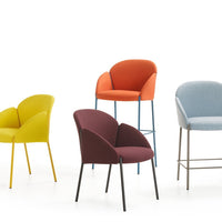 Colorful chairs featuring yellow, orange, blue, and burgundy upholstery with varied modern designs. Stylish and vibrant.