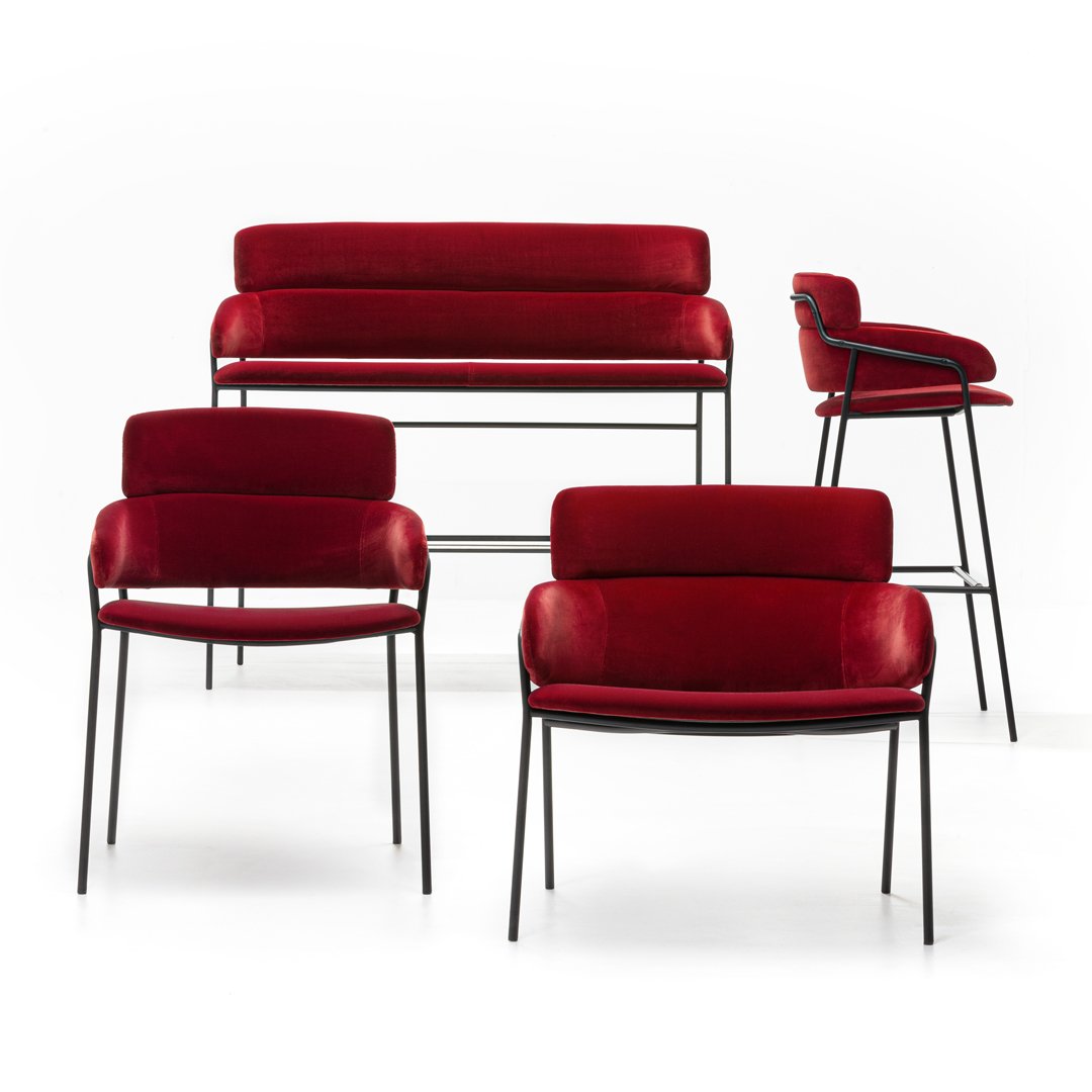 "Set of modern furniture in rich red velvet with sleek black metal legs and minimalist design."