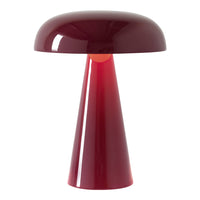 Modern burgundy table lamp featuring a sleek, glossy finish with a unique cone and dome shape.