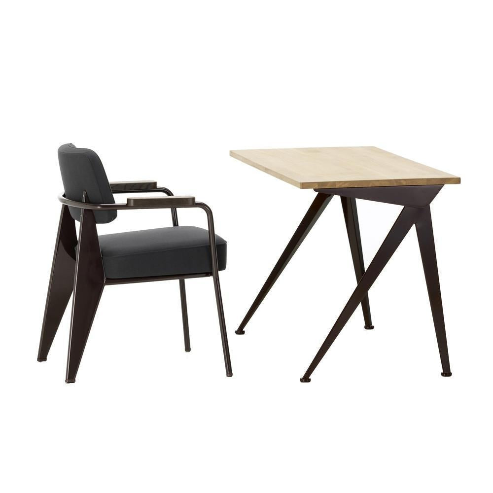 Modern black chair with gray upholstery and a natural wood tabletop on a sleek, dark metal base.