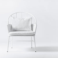 White metal chair with a textured white cushion, featuring a minimalist design against a plain background.