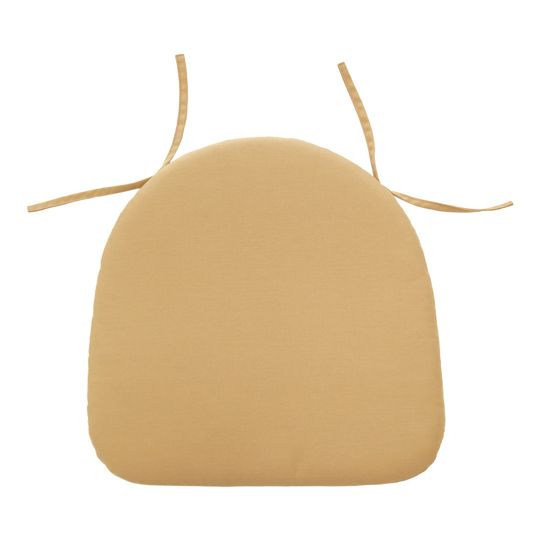 Round tan cushion with ties, featuring a smooth, solid color design, perfect for outdoor seating.
