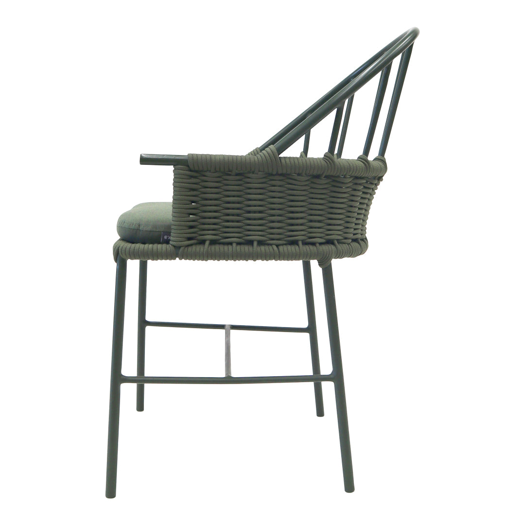 "Side view of a green wicker bar chair with sleek black metal legs and a minimalist design."