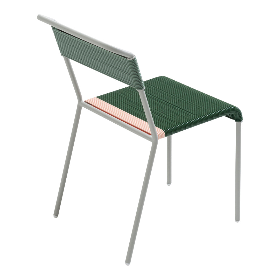 Green chair with a textured backrest and a pastel pink stripe, complemented by sleek silver metal legs.
