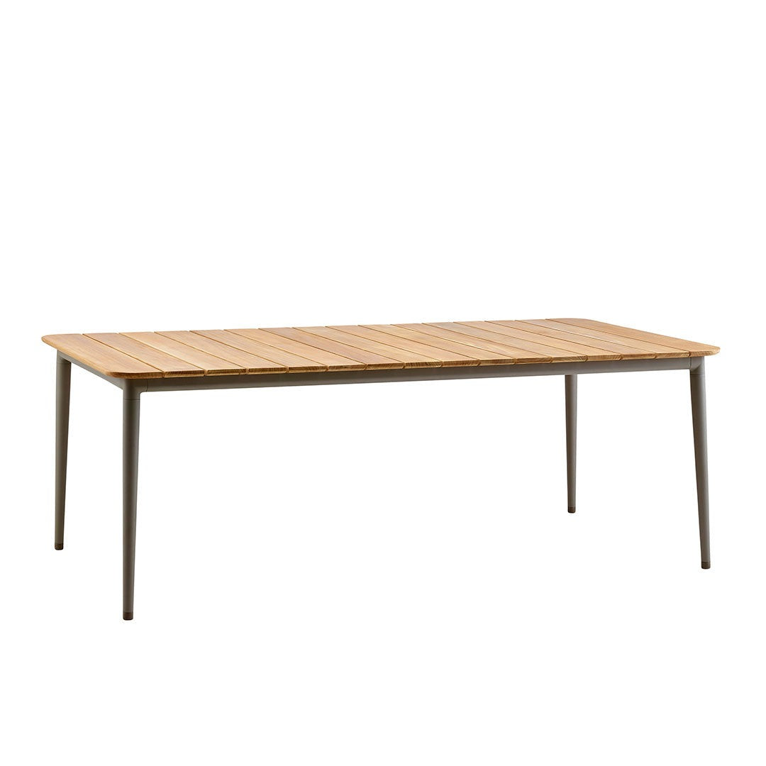 Rectangular dining table featuring a natural wood finish with horizontal slats and sleek metal legs in a matte finish.