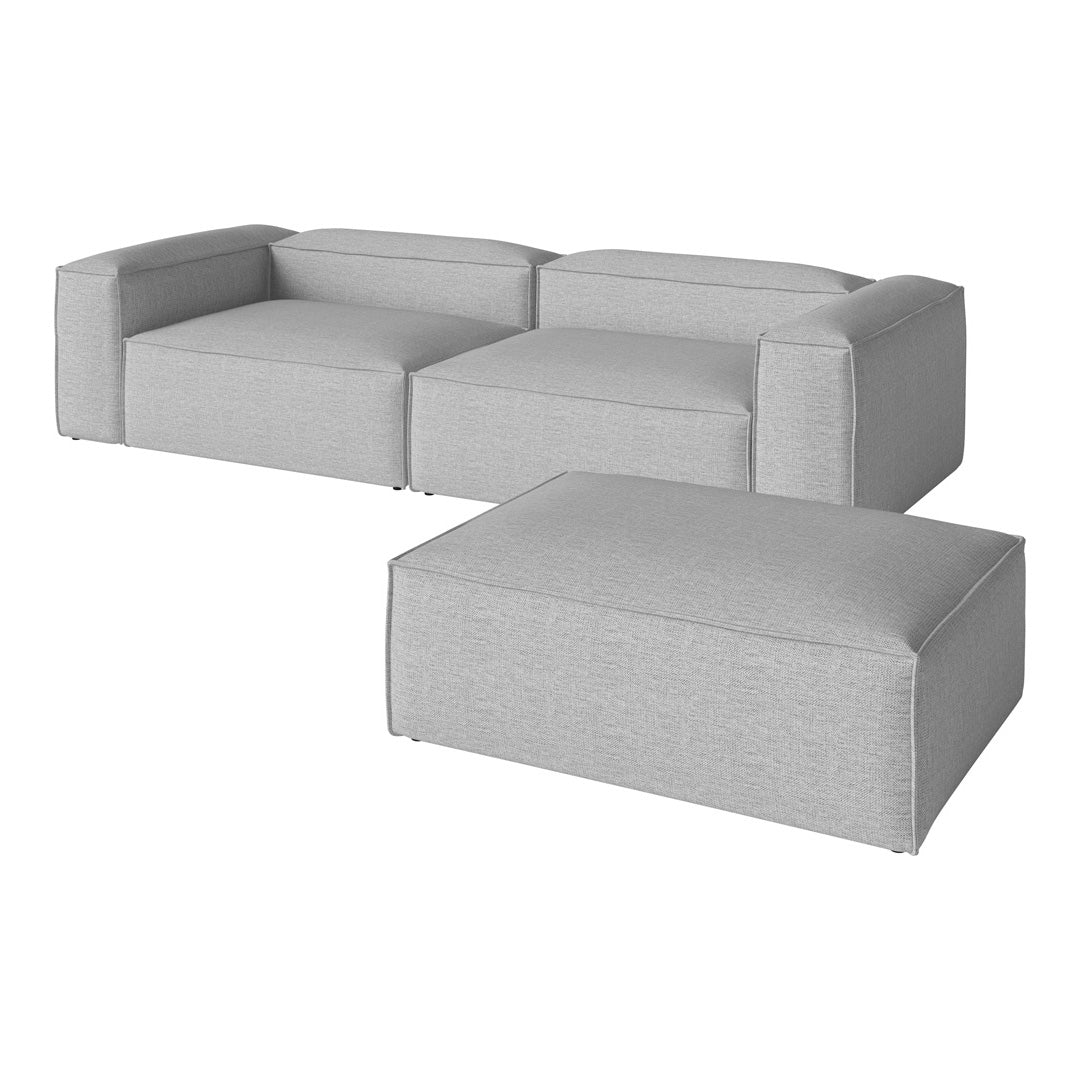 Light gray modular sofa with simple, modern design and smooth, textured fabric. Perfect for contemporary spaces.