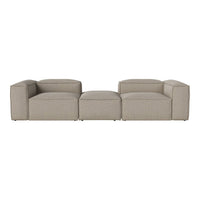 Beige modular sofa with smooth, textured fabric and clean, modern lines. Perfect for contemporary living spaces.
