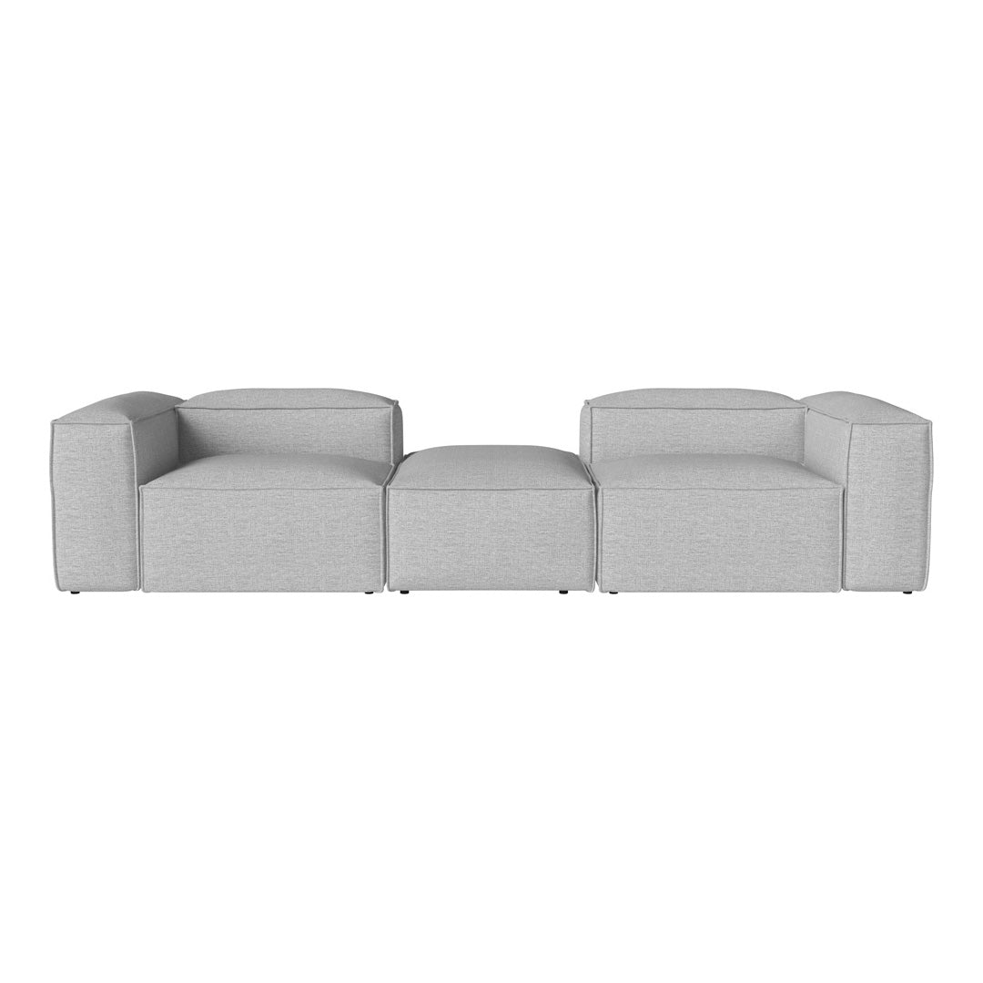 Gray modular sofa with a smooth texture and minimalist design, featuring a clean, contemporary aesthetic.