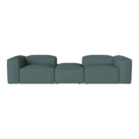 Teal modular sofa with clean lines and a textured fabric design, perfect for modern living spaces.