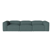 Teal modular sofa with a smooth, textured fabric and contemporary design, perfect for modern living spaces.
