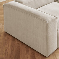 Beige corduroy upholstery with subtle ribbed texture, complementing warm wooden flooring.
