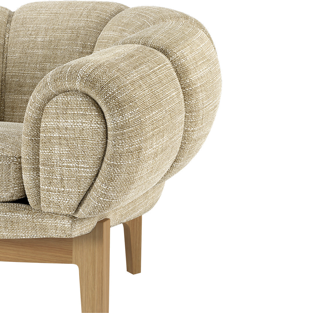 Beige textured upholstery with a subtle woven pattern, featuring rounded armrests and wooden legs.