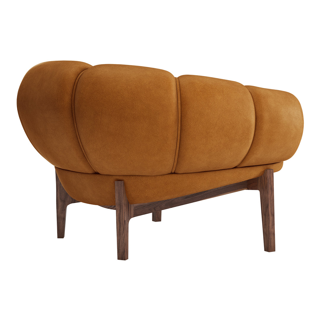 Brown suede sofa with rounded cushions and wooden legs, featuring a smooth, modern design. Ideal for stylish interiors.