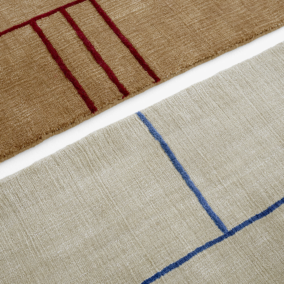 Tan and beige fabric with red and blue geometric stripes and lines, adding a modern touch to your decor.