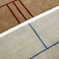 Tan and beige fabric with red and blue geometric stripes and lines, adding a modern touch to your decor.