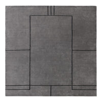 Gray rug with a geometric black pattern, featuring clean lines and modern design elements. Perfect for contemporary spaces.
