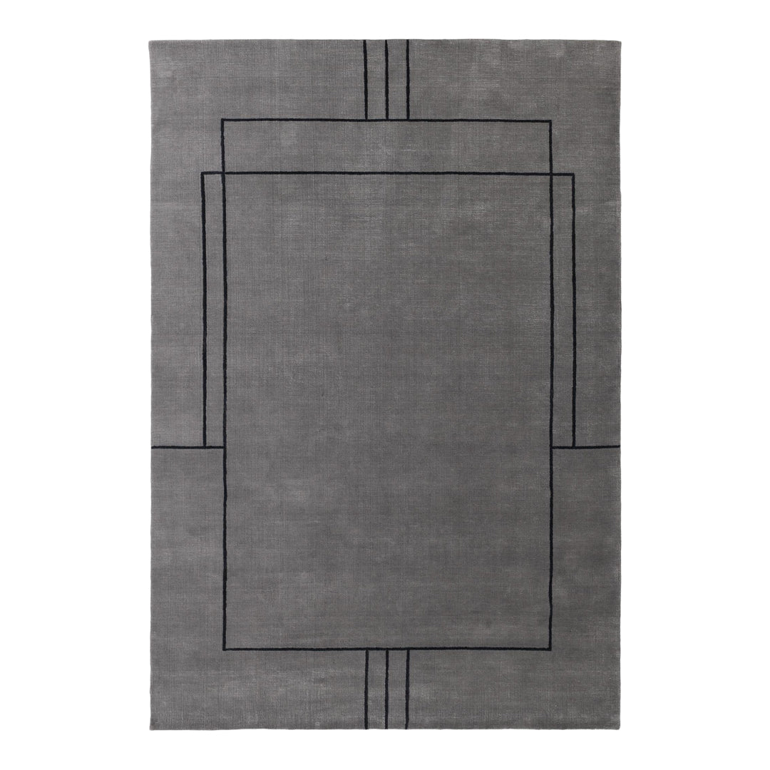 Gray area rug with geometric black line patterns and a modern design. Perfect for contemporary home décor.