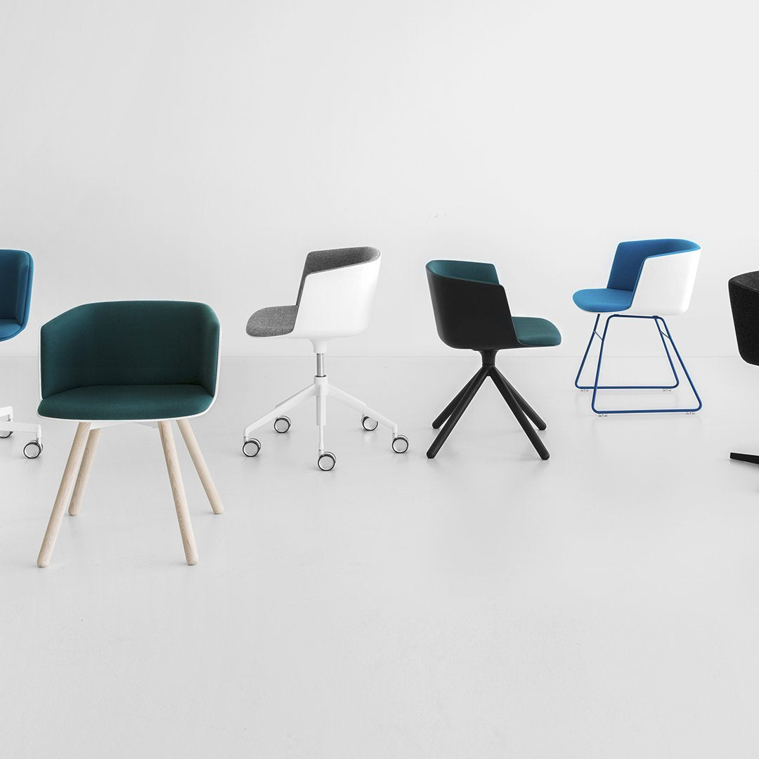 Colorful office chairs in teal, black, white, and blue with various modern patterns and styles on a minimalist background.