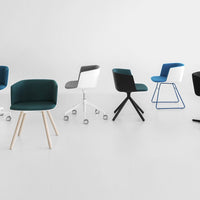Colorful office chairs in teal, black, white, and blue with various modern patterns and styles on a minimalist background.