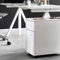 White mobile file cabinet with simple lines, complementing a sleek, modern workspace design against a gray floor.