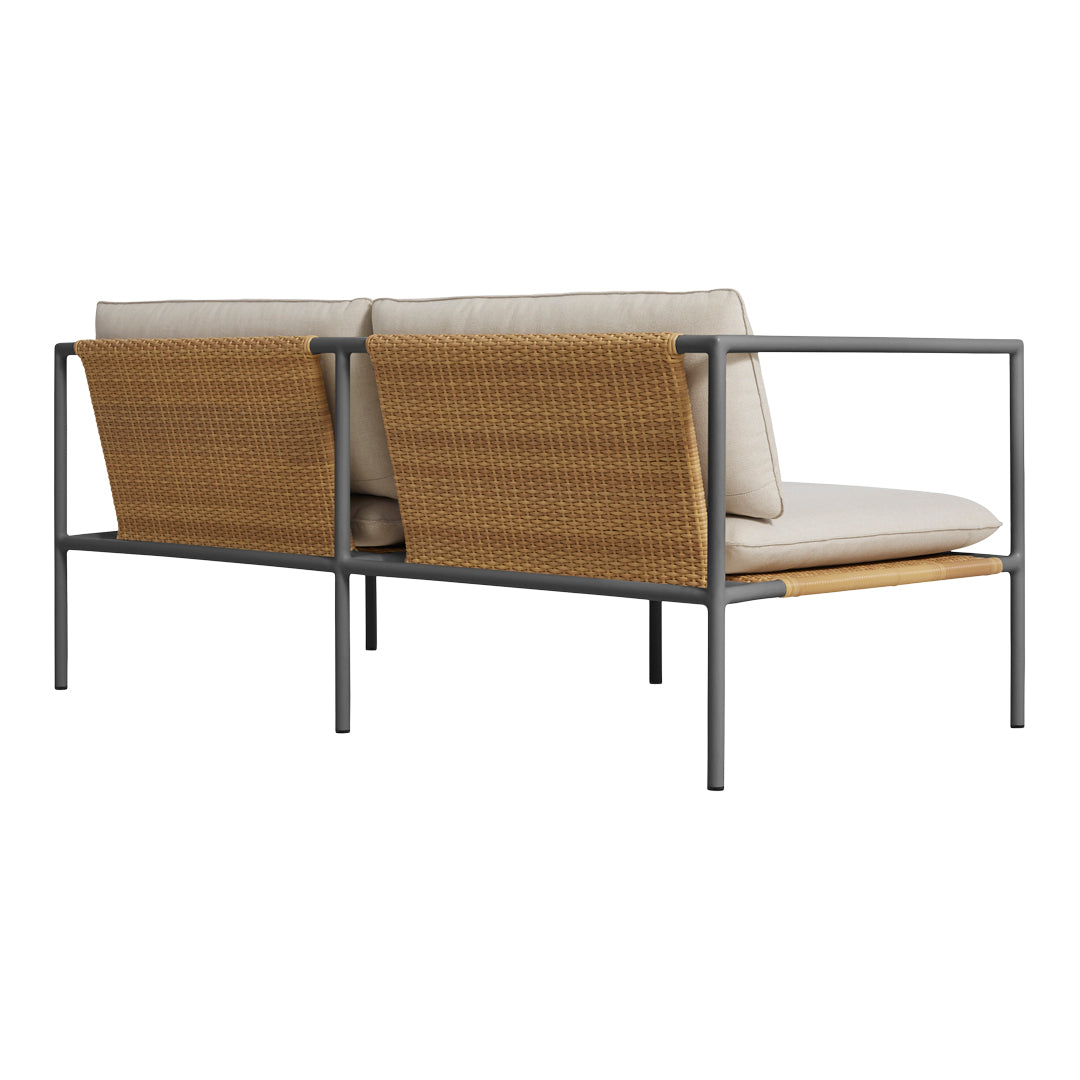 Beige cushions with light brown wicker accents and a sleek gray metal frame. Modern outdoor seating design.