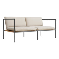 Beige cushioned sofa with sleek black metal frame and natural wood accents, designed for modern aesthetic appeal.