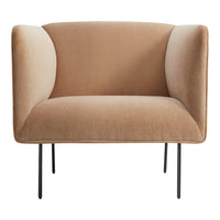 Soft beige velvet armchair with minimalist black legs, featuring a smooth, curved design for modern decor.