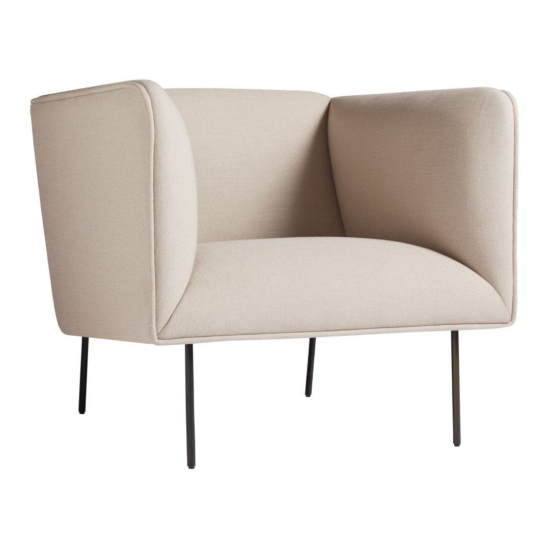 Beige upholstered armchair with smooth, minimalist design and black metal legs, perfect for modern decor.