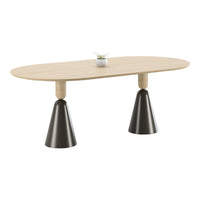 Light wood oval table with black cone-shaped legs and a minimalistic floral centerpiece. Modern and stylish design.