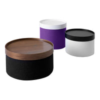 Colorful storage containers: black, white, purple, and wood, featuring smooth patterns and sleek designs.