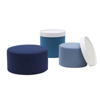 Assorted round cushions in deep navy, light blue, and soft gray with white lids and textured fabrics.