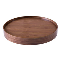 Round wooden tray in rich brown tones with a smooth, minimalist design. Elegant finish enhances any decor.