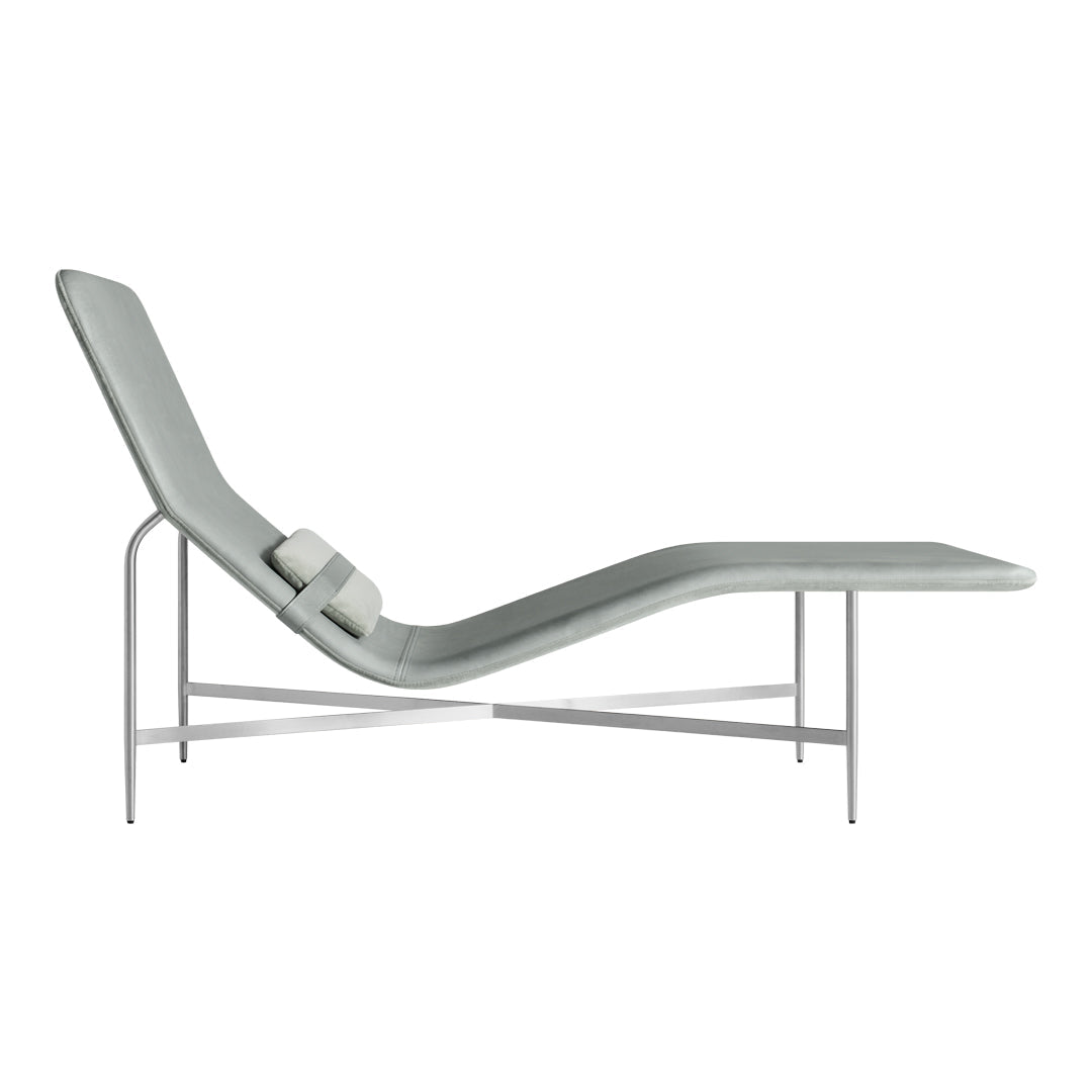 Light gray lounge chair with sleek, minimalist design and subtle curves, featuring a smooth finish and silver frame.