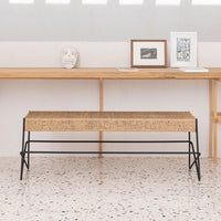 Natural wood bench with a textured beige top and sleek black metal legs, perfect for modern decor.