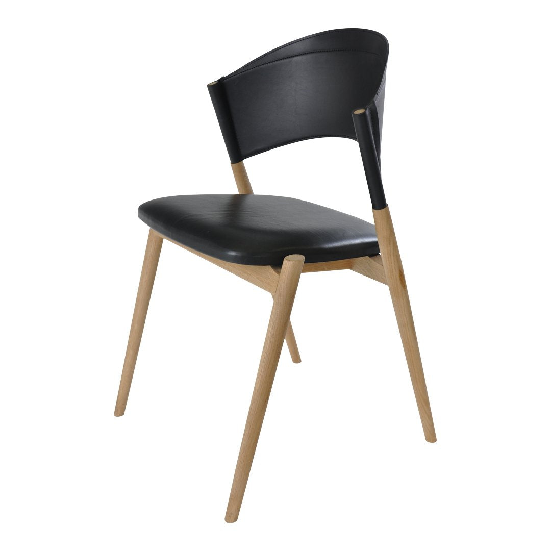 Black chair with a sleek curved back and natural wood legs, showcasing a modern design with a minimalist aesthetic.