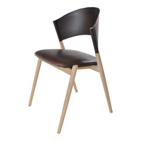 Modern chair featuring a dark brown seat and backrest with light wooden legs, showcasing a sleek, minimalist design.