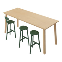 Light wood table with three dark green stools, featuring simple, modern design and smooth finishes.