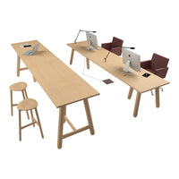 Light wood tables and stools with a natural finish; burgundy upholstered chairs add bold color accents.