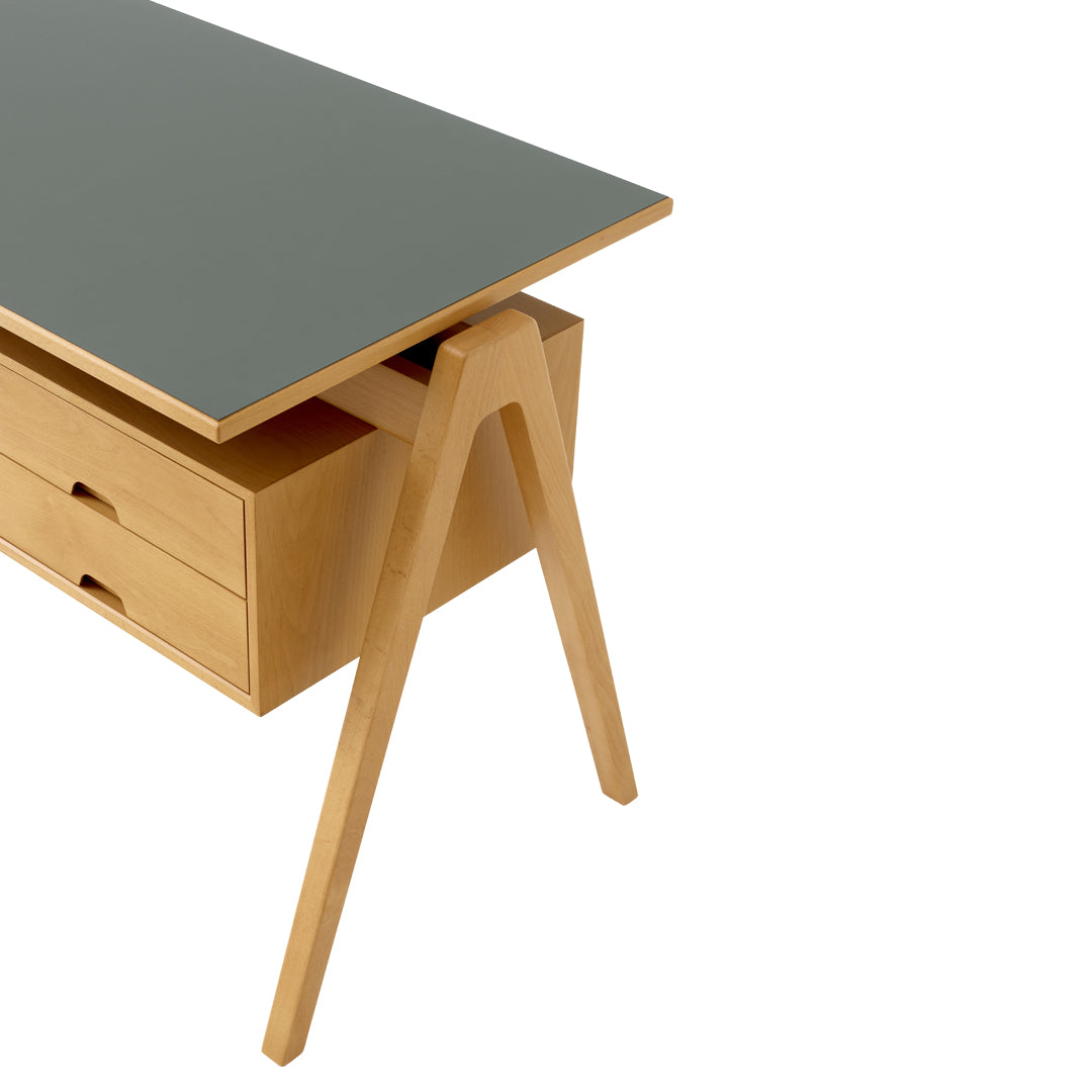 Stylish desk featuring a muted green top and natural wooden legs with simple drawer design for a modern look.