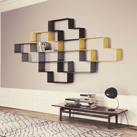 Geometric wall shelf in black and yellow with a modern pattern, enhancing contemporary home decor.