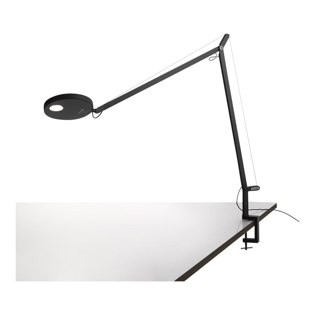 Black and white desk lamp with a minimalistic design and sleek lines, showcasing a modern aesthetic.
