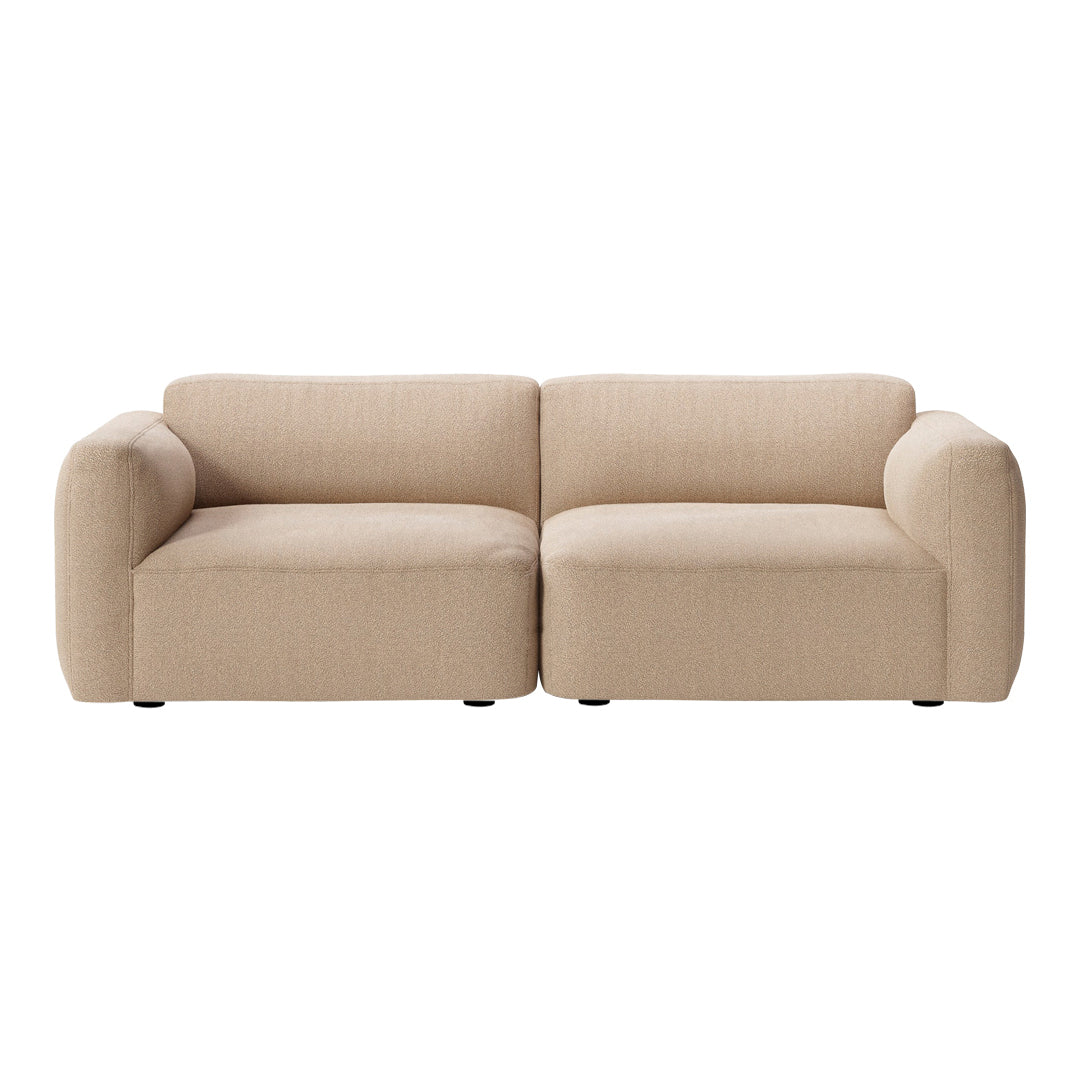 Beige modern fabric sofa with a smooth texture and rounded arms, featuring a minimalist design. Perfect for any living space.