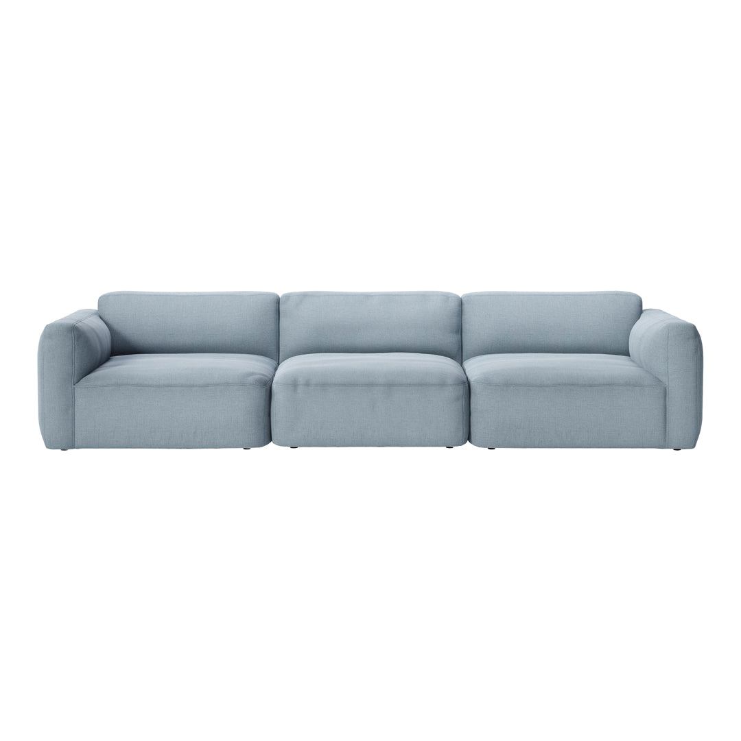 Light blue sectional sofa with a smooth, minimalist design and plush cushions, perfect for modern living spaces.