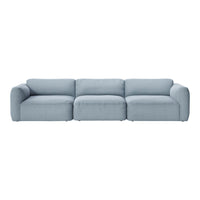 Light blue sectional sofa with a smooth, minimalist design and plush cushions, perfect for modern living spaces.